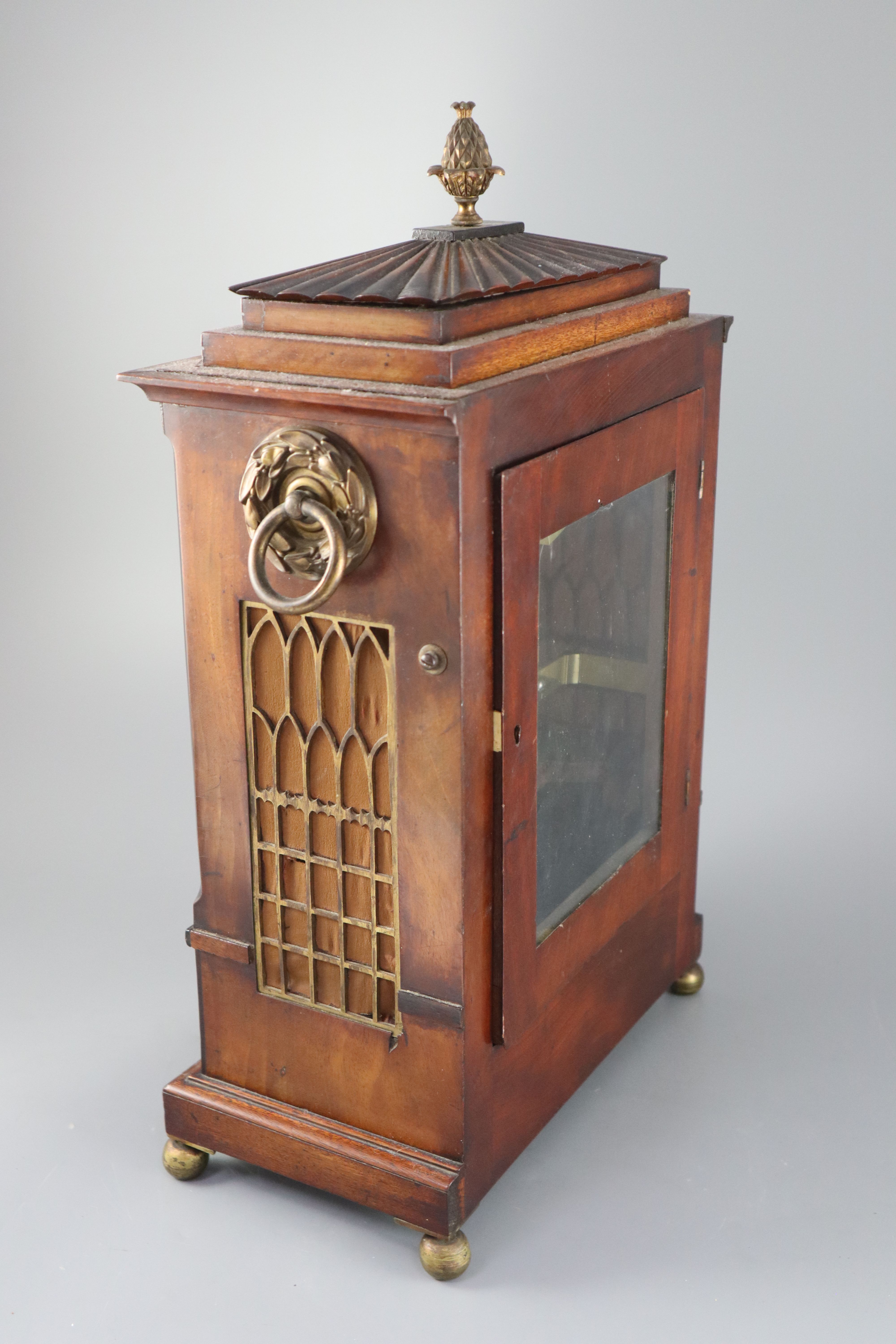 Dwerryhouse & Carter of London. A Regency brass inset mahogany mantel clock, height 19.5in.